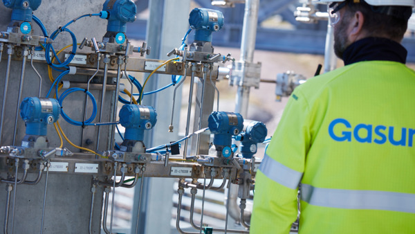 Person in safety gear in LNG terminal