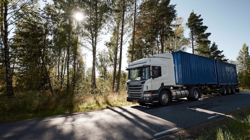 Scania's gas powered truck on a road. 